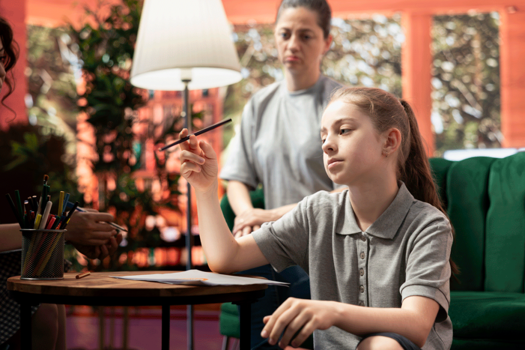 Teen girl distracted and withdrawn instead of doing homework.